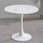 The White Round Dining Table is a modern and elegant dining table designed to bring style, comfort, and functionality to your dining space. Featuring a sleek white finish and a timeless round tabletop, this table creates a welcoming atmosphere for family meals, entertaining guests, and everyday dining. It is an excellent choice for homes, apartments, cafés, restaurants, hotels, and office dining areas. Crafted from high-quality materials, the White Round Dining Table is built for durability and long-lasting performance. Its sturdy base provides excellent stability, while the spacious tabletop offers ample room for serving meals, drinks, tableware, and decorative centerpieces. The smooth, scratch-resistant surface is easy to clean and maintain, making it ideal for busy households and commercial dining environments. The round design encourages conversation and allows everyone to interact comfortably, making it perfect for family gatherings and social occasions. Its minimalist white finish blends effortlessly with modern, Scandinavian, contemporary, and classic interiors, adding brightness and sophistication to any room. Whether you're furnishing a dining room, kitchen, restaurant, café, or hotel, the White Round Dining Table offers the perfect combination of elegance, practicality, and durability. Key Features Elegant white contemporary finish Spacious round tabletop for comfortable dining Strong and durable construction Stable base for reliable support Scratch-resistant and easy-to-clean surface Modern, minimalist design Space-saving round shape for easy seating Suitable for homes, apartments, cafés, restaurants, hotels, and office dining areas Complements modern, Scandinavian, and contemporary interiors Easy to assemble and built for everyday use