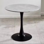 The White Round Dining Table is a modern and elegant dining table designed to bring style, comfort, and functionality to your dining space. Featuring a sleek white finish and a timeless round tabletop, this table creates a welcoming atmosphere for family meals, entertaining guests, and everyday dining. It is an excellent choice for homes, apartments, cafés, restaurants, hotels, and office dining areas. Crafted from high-quality materials, the White Round Dining Table is built for durability and long-lasting performance. Its sturdy base provides excellent stability, while the spacious tabletop offers ample room for serving meals, drinks, tableware, and decorative centerpieces. The smooth, scratch-resistant surface is easy to clean and maintain, making it ideal for busy households and commercial dining environments. The round design encourages conversation and allows everyone to interact comfortably, making it perfect for family gatherings and social occasions. Its minimalist white finish blends effortlessly with modern, Scandinavian, contemporary, and classic interiors, adding brightness and sophistication to any room. Whether you're furnishing a dining room, kitchen, restaurant, café, or hotel, the White Round Dining Table offers the perfect combination of elegance, practicality, and durability. Key Features Elegant white contemporary finish Spacious round tabletop for comfortable dining Strong and durable construction Stable base for reliable support Scratch-resistant and easy-to-clean surface Modern, minimalist design Space-saving round shape for easy seating Suitable for homes, apartments, cafés, restaurants, hotels, and office dining areas Complements modern, Scandinavian, and contemporary interiors Easy to assemble and built for everyday use
