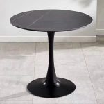 The White Round Dining Table is a modern and elegant dining table designed to bring style, comfort, and functionality to your dining space. Featuring a sleek white finish and a timeless round tabletop, this table creates a welcoming atmosphere for family meals, entertaining guests, and everyday dining. It is an excellent choice for homes, apartments, cafés, restaurants, hotels, and office dining areas. Crafted from high-quality materials, the White Round Dining Table is built for durability and long-lasting performance. Its sturdy base provides excellent stability, while the spacious tabletop offers ample room for serving meals, drinks, tableware, and decorative centerpieces. The smooth, scratch-resistant surface is easy to clean and maintain, making it ideal for busy households and commercial dining environments. The round design encourages conversation and allows everyone to interact comfortably, making it perfect for family gatherings and social occasions. Its minimalist white finish blends effortlessly with modern, Scandinavian, contemporary, and classic interiors, adding brightness and sophistication to any room. Whether you're furnishing a dining room, kitchen, restaurant, café, or hotel, the White Round Dining Table offers the perfect combination of elegance, practicality, and durability. Key Features Elegant white contemporary finish Spacious round tabletop for comfortable dining Strong and durable construction Stable base for reliable support Scratch-resistant and easy-to-clean surface Modern, minimalist design Space-saving round shape for easy seating Suitable for homes, apartments, cafés, restaurants, hotels, and office dining areas Complements modern, Scandinavian, and contemporary interiors Easy to assemble and built for everyday use