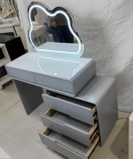 The Modern White Dressing Table is an elegant and functional bedroom furniture piece designed to provide a stylish space for grooming, makeup, and personal organization. Featuring a sleek white finish and a contemporary design, this dressing table adds a clean and sophisticated look to bedrooms, apartments, dressing rooms, and guest spaces. Made from high-quality materials, the dressing table is built for durability and everyday use. Its spacious tabletop provides enough room for cosmetics, perfumes, jewelry, skincare products, and decorative accessories, while the storage drawers help keep personal items neatly arranged and easily accessible. The smooth white surface is easy to clean and maintain, ensuring a fresh and attractive appearance for years. Designed to complement modern, minimalist, and contemporary interiors, the Modern White Dressing Table combines beauty, practicality, and storage convenience. It is an ideal choice for homeowners looking to create an organized and stylish personal grooming area. Key Features Elegant modern white finish Spacious tabletop for beauty essentials Multiple drawers for organized storage Durable and sturdy construction Smooth, scratch-resistant surface Easy-to-clean and maintain design Compact and space-saving structure Ideal for bedrooms, dressing rooms, apartments, and guest rooms Complements modern and minimalist décor Built for long-lasting everyday use