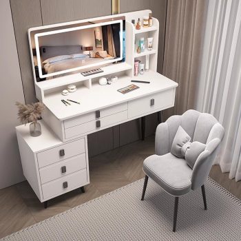 The White Dressing Table With Mirror is a stylish and practical bedroom furniture piece designed to provide a complete grooming and storage solution. Featuring an elegant white finish, spacious tabletop, built-in mirror, and convenient storage compartments, this dressing table adds beauty, organization, and functionality to modern bedrooms, apartments, dressing rooms, and guest spaces. Crafted from high-quality materials, the dressing table offers excellent durability and stability for everyday use. The large mirror provides a clear and comfortable view for makeup, hairstyling, and personal grooming, while the spacious drawers and compartments help keep cosmetics, jewelry, perfumes, skincare products, and accessories neatly organized. Its smooth white surface is easy to clean and maintains a fresh, elegant appearance. With its modern design and practical features, the White Dressing Table With Mirror complements contemporary, minimalist, and luxury bedroom interiors. It is the perfect choice for anyone looking to create a beautiful and organized personal grooming area. Key Features Elegant white modern finish Built-in mirror for convenient grooming Spacious tabletop for beauty essentials Multiple drawers and storage compartments Durable and stable construction Smooth, easy-to-clean surface Stylish design for modern bedrooms Ideal for cosmetics, jewelry, perfumes, and accessories Suitable for bedrooms, apartments, dressing rooms, and guest rooms Built for long-lasting everyday use