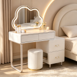 The Modern White Dressing Table is an elegant and functional bedroom furniture piece designed to provide a stylish space for grooming, makeup, and personal organization. Featuring a sleek white finish and a contemporary design, this dressing table adds a clean and sophisticated look to bedrooms, apartments, dressing rooms, and guest spaces. Made from high-quality materials, the dressing table is built for durability and everyday use. Its spacious tabletop provides enough room for cosmetics, perfumes, jewelry, skincare products, and decorative accessories, while the storage drawers help keep personal items neatly arranged and easily accessible. The smooth white surface is easy to clean and maintain, ensuring a fresh and attractive appearance for years. Designed to complement modern, minimalist, and contemporary interiors, the Modern White Dressing Table combines beauty, practicality, and storage convenience. It is an ideal choice for homeowners looking to create an organized and stylish personal grooming area. Key Features Elegant modern white finish Spacious tabletop for beauty essentials Multiple drawers for organized storage Durable and sturdy construction Smooth, scratch-resistant surface Easy-to-clean and maintain design Compact and space-saving structure Ideal for bedrooms, dressing rooms, apartments, and guest rooms Complements modern and minimalist décor Built for long-lasting everyday use