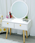 The White Modern Dressing Table is a stylish and functional furniture piece designed to add elegance and convenience to your bedroom or dressing area. Featuring a sleek white finish and a contemporary design, this dressing table provides the perfect space for your daily makeup, skincare, and grooming routine while enhancing the overall look of your interior. Crafted from high-quality engineered wood, the dressing table is built for durability and long-lasting performance. Its spacious tabletop offers plenty of room for cosmetics, perfumes, beauty accessories, and decorative items, while the integrated drawers provide ample storage to keep your essentials neatly organized and easily accessible. The smooth, scratch-resistant surface is easy to clean, making it ideal for everyday use. Designed to complement modern, minimalist, and contemporary décor, the White Modern Dressing Table is perfect for bedrooms, apartments, dressing rooms, and guest rooms. Whether you're furnishing a new home or upgrading your bedroom furniture, this dressing table delivers the perfect combination of style, functionality, and lasting quality. Key Features Elegant modern white finish Spacious tabletop for makeup and beauty essentials Multiple storage drawers for organized storage Durable engineered wood construction Smooth, scratch-resistant, and easy-to-clean surface Strong and stable design for everyday use Compact and space-saving for smaller rooms Suitable for bedrooms, dressing rooms, apartments, and guest rooms Complements modern, minimalist, and contemporary interiors Easy to assemble and built for long-lasting durability