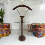 Mahogany Coat Hanger Elegant Mahogany Coat Hanger for Offices, Homes, and Reception Areas The Mahogany Coat Hanger is a stylish and practical storage solution designed to keep coats, jackets, hats, scarves, bags, and other accessories neatly organized while enhancing the appearance of your interior. With its rich mahogany finish and timeless design, this coat hanger adds warmth and sophistication to executive offices, reception areas, homes, hotels, bedrooms, and waiting lounges. Crafted from high-quality wood, the coat hanger is built for durability, stability, and long-lasting everyday use. Its sturdy construction provides reliable support for multiple garments without wobbling, while the smooth polished finish protects clothing and adds an elegant touch to any room. The vertical design maximizes storage capacity while occupying minimal floor space, making it an excellent choice for both compact and spacious interiors. Mahogany Coat Hanger Features Designed for convenience and organization, this wooden coat stand helps keep clothing and accessories within easy reach while maintaining a tidy and professional environment. The classic mahogany finish blends seamlessly with executive, modern, traditional, and contemporary décor styles, making it suitable for a wide range of residential and commercial settings. Key Features Elegant mahogany wood finish Strong and durable wooden construction Multiple hooks for coats, jackets, hats, bags, and scarves Stable base for secure placement Space-saving vertical design Smooth polished surface that protects clothing Suitable for offices, homes, hotels, bedrooms, and reception areas Easy to clean and maintain Complements modern and classic interiors Built for long-lasting daily use