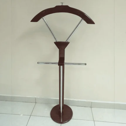 Mahogany Coat Hanger Elegant Mahogany Coat Hanger for Offices, Homes, and Reception Areas The Mahogany Coat Hanger is a stylish and practical storage solution designed to keep coats, jackets, hats, scarves, bags, and other accessories neatly organized while enhancing the appearance of your interior. With its rich mahogany finish and timeless design, this coat hanger adds warmth and sophistication to executive offices, reception areas, homes, hotels, bedrooms, and waiting lounges. Crafted from high-quality wood, the coat hanger is built for durability, stability, and long-lasting everyday use. Its sturdy construction provides reliable support for multiple garments without wobbling, while the smooth polished finish protects clothing and adds an elegant touch to any room. The vertical design maximizes storage capacity while occupying minimal floor space, making it an excellent choice for both compact and spacious interiors. Mahogany Coat Hanger Features Designed for convenience and organization, this wooden coat stand helps keep clothing and accessories within easy reach while maintaining a tidy and professional environment. The classic mahogany finish blends seamlessly with executive, modern, traditional, and contemporary décor styles, making it suitable for a wide range of residential and commercial settings. Key Features Elegant mahogany wood finish Strong and durable wooden construction Multiple hooks for coats, jackets, hats, bags, and scarves Stable base for secure placement Space-saving vertical design Smooth polished surface that protects clothing Suitable for offices, homes, hotels, bedrooms, and reception areas Easy to clean and maintain Complements modern and classic interiors Built for long-lasting daily use