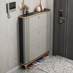 The Brown Shoe Rack Storage Cabinet is a stylish and practical storage solution designed to keep your footwear organized while adding elegance to your home or office space. Featuring a rich brown finish and a modern cabinet design, this shoe storage unit helps maintain a neat and clutter-free environment in entryways, bedrooms, closets, hallways, and dressing areas. Made from high-quality materials, the cabinet provides durable and reliable storage for shoes, sandals, sneakers, boots, and other footwear. Its enclosed design helps protect shoes from dust while keeping your space looking clean and organized. Multiple compartments offer convenient storage, allowing you to arrange different shoe sizes and styles with ease. With its compact and space-saving design, the Brown Shoe Rack Storage Cabinet is ideal for apartments, family homes, offices, and commercial spaces. It combines functionality, durability, and modern style to complement various interior décor themes. Key Features Elegant brown wood finish Spacious shoe storage compartments Enclosed cabinet design for dust protection Durable and sturdy construction Space-saving design for organized storage Smooth, easy-to-clean surface Keeps shoes neatly arranged and accessible Suitable for bedrooms, entryways, closets, hallways, and offices Complements modern and contemporary interiors Built for long-lasting everyday use