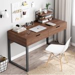 The Brown Office Study Desk is a stylish, durable, and functional workstation designed to create a productive environment for studying, working, reading, and writing. Featuring a rich brown wood finish and a contemporary design, this desk blends elegance with practicality, making it an excellent choice for home offices, corporate offices, study rooms, libraries, schools, and student bedrooms. Crafted from high-quality engineered wood and supported by a sturdy frame, the desk is built for long-lasting performance and everyday use. Its spacious tabletop provides ample room for laptops, desktop computers, books, documents, stationery, and other office essentials. The smooth, scratch-resistant surface is easy to clean and maintain, ensuring the desk retains its professional appearance over time. The Brown Office Study Desk is designed to maximize comfort and efficiency while complementing modern, minimalist, and classic interiors. Whether you're working from home, studying for exams, or managing daily office tasks, this desk offers the ideal combination of style, durability, and functionality. Key Features Elegant brown wood finish Spacious work surface for studying and office tasks Durable engineered wood construction Strong and stable frame for everyday use Scratch-resistant and easy-to-clean surface Modern and space-saving design Suitable for laptops, desktop computers, books, and office accessories Ideal for home offices, study rooms, schools, libraries, and workplaces Complements modern, contemporary, and classic interiors Easy to assemble and built for long-lasting performance