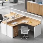 Modern 2 Way Curved Office Workstation for Collaborative Workspaces The 2 Way Curved Office Workstation is a stylish, ergonomic, and space-efficient office furniture solution designed to accommodate two users while promoting collaboration and productivity. Its modern curved design creates a comfortable working environment by maximizing individual workspace without compromising office space. This workstation is ideal for corporate offices, call centers, co-working spaces, startups, educational institutions, and home offices. Constructed from premium engineered wood with a heavy-duty steel frame, the workstation delivers exceptional durability, stability, and long-lasting performance. Each user benefits from a spacious work surface that comfortably accommodates desktop computers, laptops, files, office supplies, and other daily work essentials. The smooth, scratch-resistant finish is easy to clean, ensuring the workstation maintains its professional appearance even in busy office environments. 2 Way Curved Office Workstation Features Designed to improve workflow and optimize office layouts, this curved office workstation combines functionality with contemporary style. The ergonomic curved desktop provides a more comfortable working position, while the compact footprint makes it suitable for both small and large offices. Its elegant design complements modern, minimalist, and professional office interiors. Key Features Two-person curved workstation design Spacious individual workstations Durable engineered wood tabletop Heavy-duty steel frame for superior stability Ergonomic curved desktop layout Scratch-resistant and easy-to-clean surface Space-saving design for efficient office planning Suitable for offices, call centers, co-working spaces, schools, and home offices Modern design complements contemporary office interiors Easy to assemble and built for long-lasting daily use