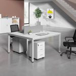 The 2 Way White Office Workstation is a modern and space-saving office furniture solution designed to provide an efficient and comfortable workspace for two users. Featuring a sleek white finish and a contemporary design, this workstation enhances the appearance of any office while promoting collaboration, productivity, and organization. It is ideal for corporate offices, startups, co-working spaces, call centers, educational institutions, and home offices. Constructed from high-quality engineered wood and supported by a sturdy steel frame, the workstation is built for durability and long-term performance. Each user enjoys a spacious work surface for laptops, desktop computers, files, and office accessories, ensuring a clutter-free and productive working environment. The scratch-resistant tabletop is easy to clean, while the strong frame provides excellent stability for everyday use. Designed to maximize office space without compromising comfort, the 2 Way White Office Workstation blends seamlessly with modern, minimalist, and contemporary office interiors. It is an excellent choice for businesses looking to create a professional and organized workspace. Key Features Two-person office workstation design Elegant white modern finish Spacious individual workstations Durable engineered wood tabletop Heavy-duty steel frame for enhanced stability Scratch-resistant and easy-to-clean surface Space-saving design for efficient office layouts Suitable for offices, co-working spaces, call centers, schools, and home offices Modern appearance that complements contemporary interiors Easy to assemble and built for long-lasting daily use